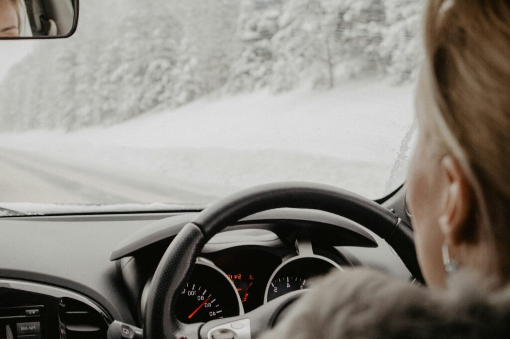 Woman driving a car on a winter day